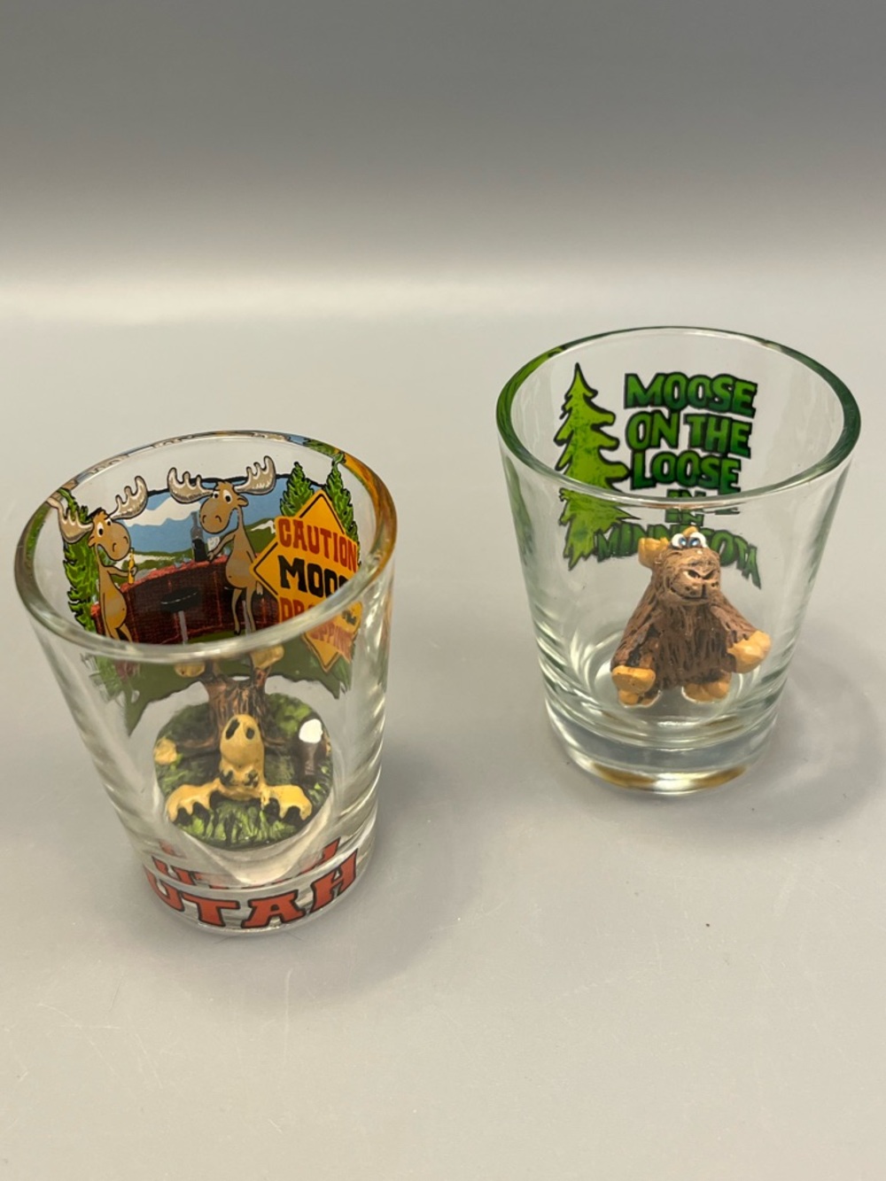(2) Moose Shot Glasses From Utah & Minnesota Moose On The Loose In Minnesota